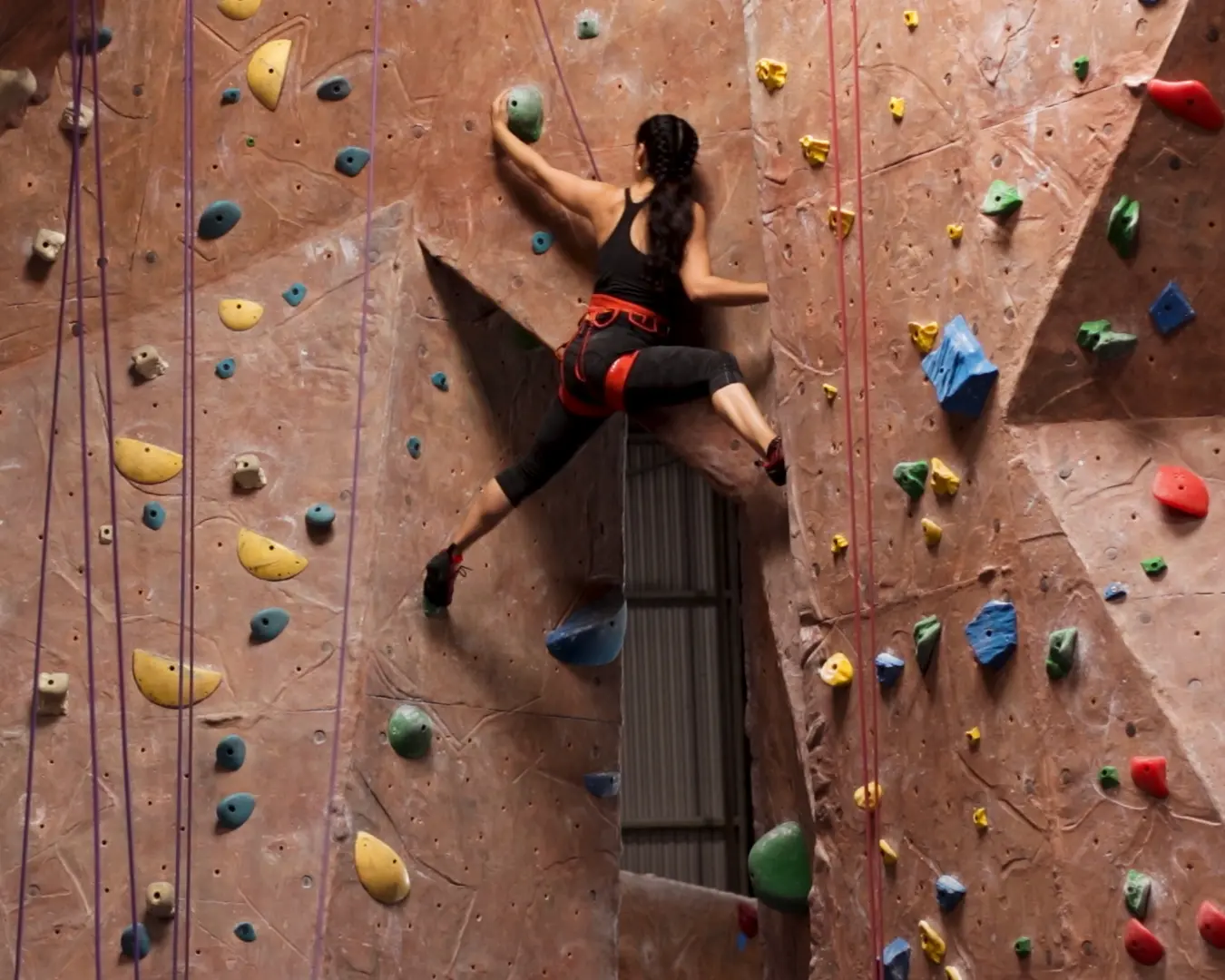 Girl rockclimbs